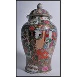 A decorative hand painted famille rose lidded temple pot depicting domestic scenes. Ochre red