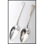 Two early 19th century Georgian silver hallmarked basting / table spoons. One by George Turner