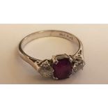 An 18ct white gold and platinum ladies diamond and ruby 3 stone ring. The diamonds approx 20pnts