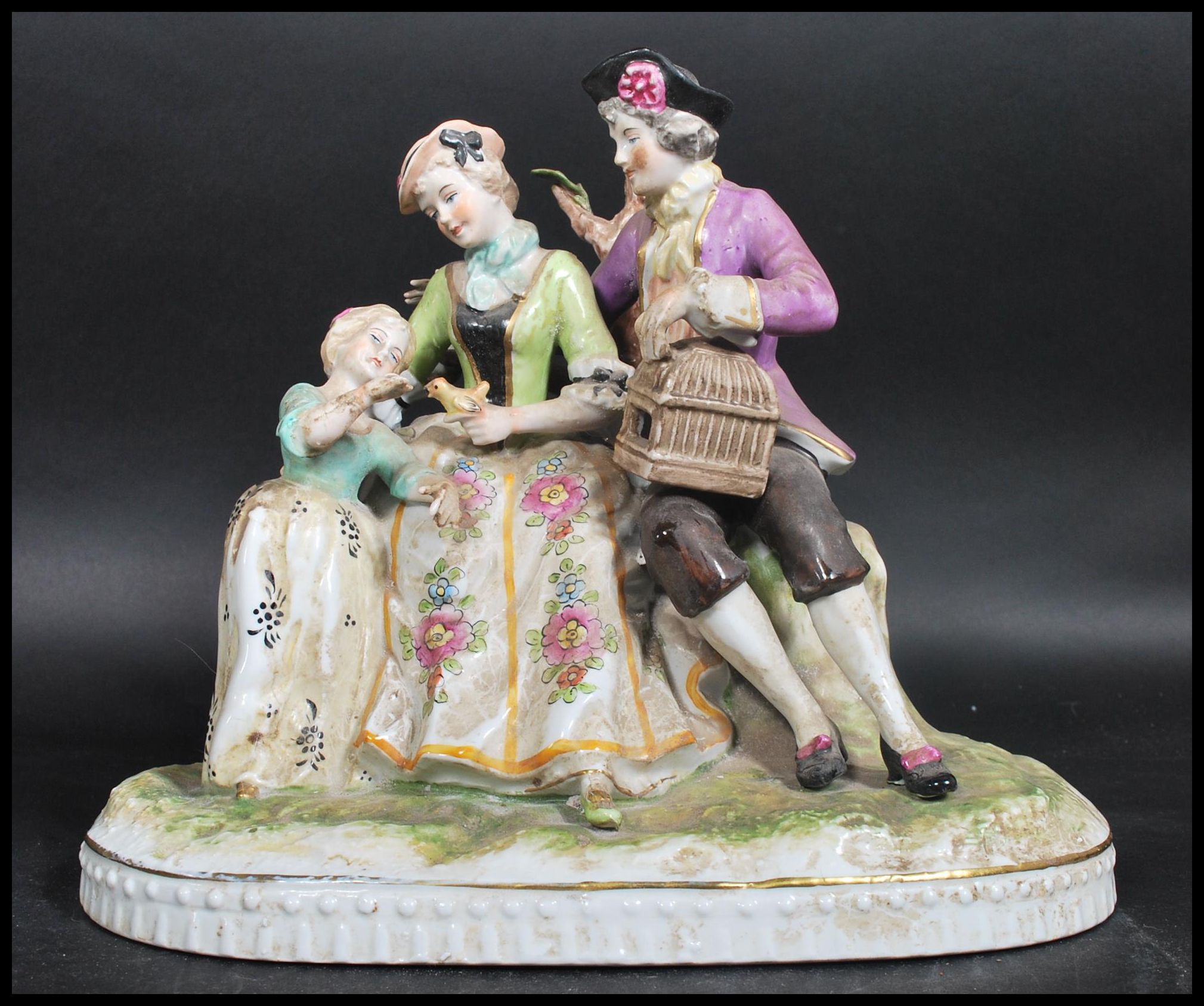 A 19th century Wilhelm Rittirsch German diorama figure group. The figurine depicting a family with