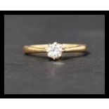 A hallmarked 18ct gold diamond solitaire ring. Diamond approx 25 points. Hallmarked London. Weight