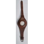 An Edwardian silver  pocket watch with early protective leather wrist strap. The small fob watch