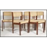 A set of 6 20th century retro teak wood dining chairs by Baumann. Raised on squared legs with waffle