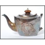 A Victorian silver hallmarked teapot with shaped faux wooden handle. Hallmarked for Birmingham by S.