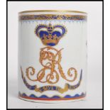 A 19th / 20th century Chinese export ceramic tankard mug having gilt and cobalt decoration depicting