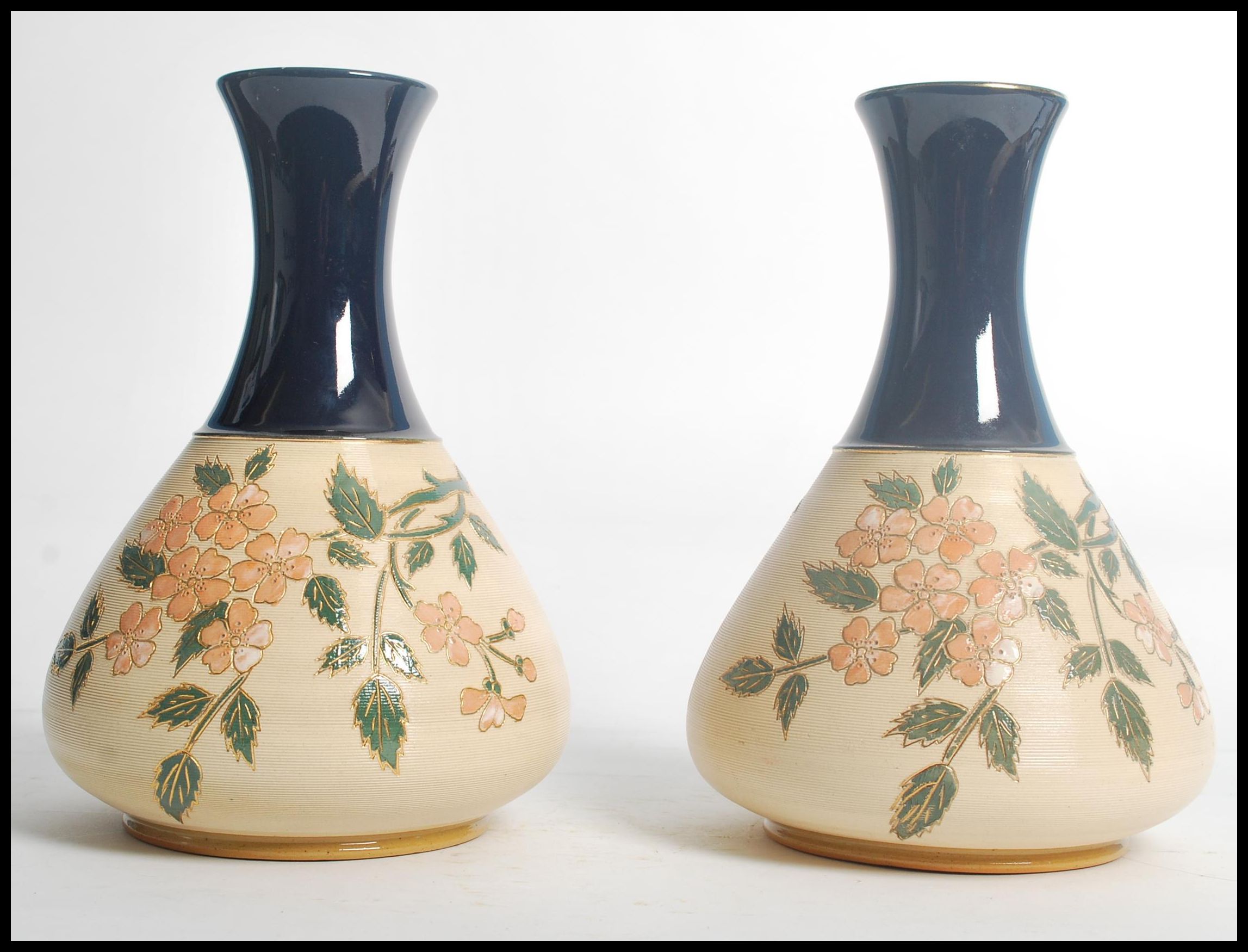 A pair of early 20th century Langley Mill stone wear vases having cobalt tapering necks with