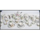 A Portmeirion Botanic Garden tea service consisting of cups saucers, jugs, condiments, teapots,