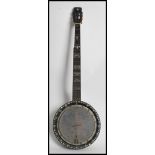 A vintage early 20th century six string  banjo decorated with mother of pearl inlaid detail to the