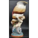 A Minton majolica large triton conch shell vase - jug. The large conch shell with seaweed swags