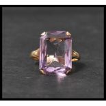 A vintage hallmarked 9ct gold and amethyst ring. The ring having a large faceted amethyst stone