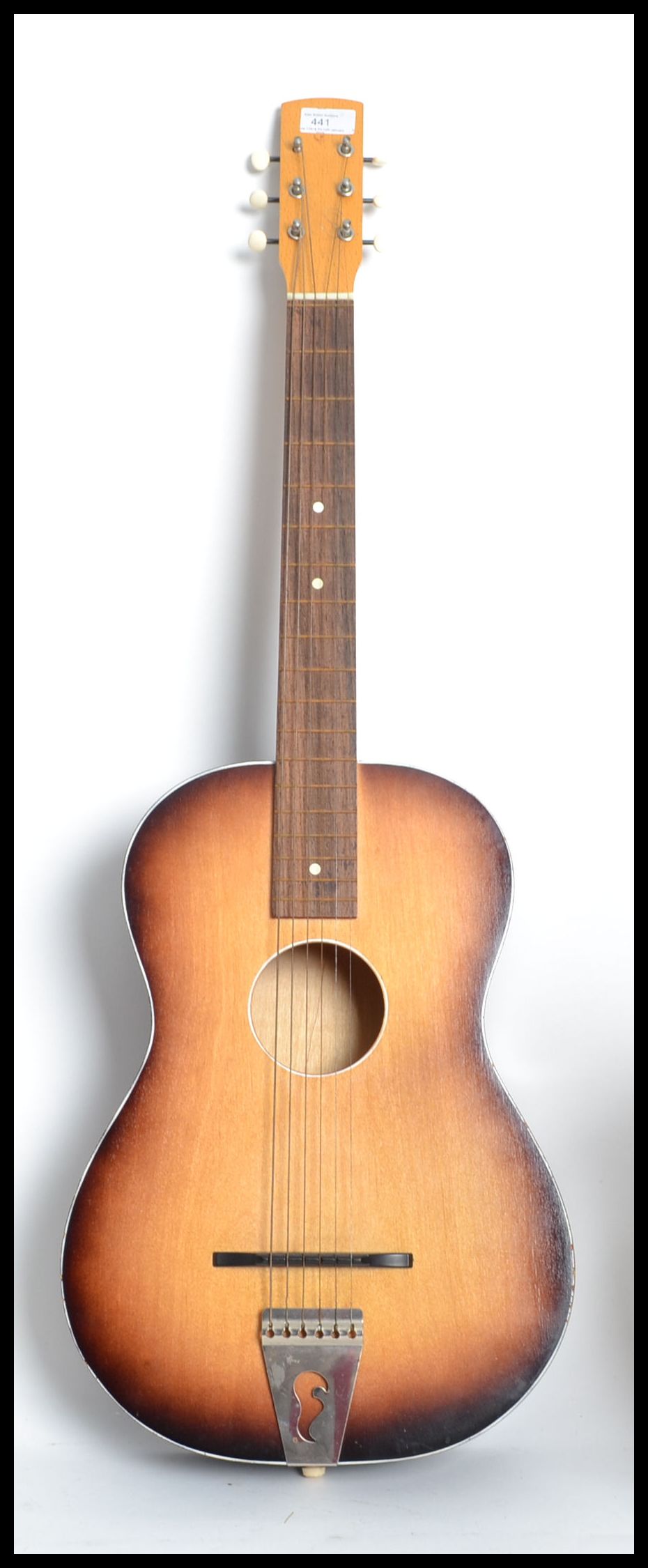 A mid 20th century Spanish acoustic six string guitar having a shaped body.