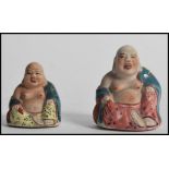 Two Chinese miniature ceramic laughing Buddha's having polychrome decoration and impressed and