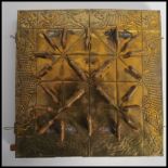 A vintage Oriental Nepal brass Bagha-Chal moving tigers game and board featuring brass tigers and