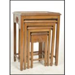 A 20th century Oriental Chinese hardwood quartetto nest of for tables having carved borders with