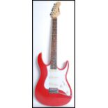 A vintage Black Knight electric six string guitar having a red body with white scratch guard and