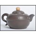 A Chinese Yi Zing terracotta teapot having a ball finial lid with star decoration and character