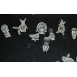 A group of Swarovski miniature animals to include kangaroos , beavers , anteater , rhino , hippo