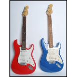 Two vintage electric guitars on being a Cruiser Grafter having a shaped red body with white