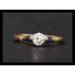 An 18ct gold and diamond solitaire ring. Marked 750, tests 18ct gold. Diamond approx 15 points.