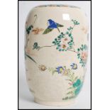 A 19th century Japanese vase having hand painted decoration of flowers and birds. Measures 18cms