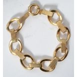 A modern designer Italian sterling silver gilt bracelet of hoop form having a bolt ring clasp.