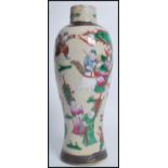 A 20th century Chinese crackle glaze vase having a waisted neck. The vase depicting domestic