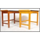 A pair of mid 20th century GPO workmen desks / work benches, raised on square supports united by