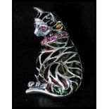 A sterling silver plique a jour brooch in the form of a seated cat with pin to verso. Weighs 7.8