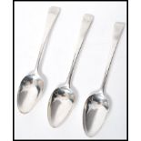 A group of three early 19th century Georgian silver hallmarked table / basting serving spoons. One