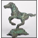 A 19th century Chinese bronze figurine of a galloping horse raised on a pedestal base. Measures