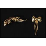 A 9ct gold and ruby lizard brooch pin verso together with a 9ct gold brooch in the form of a box.