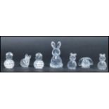 A group of seven Swarovski faceted glass figurines of rabbits / bunnies of varying size and form.