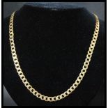 A hallmarked 9ct gold flat curb link chain necklace having a lobster claw clasp. Hallmarked