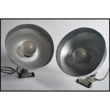 A vintage pair of retro industrial factory pendant desk spot lamp lights having chrome shades with