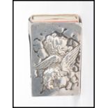 An early 20th century silver hallmarked match box holder having two cherubs to the front. Hallmarked