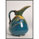 A 1930's Art Deco pottery ewer jug by Phoenix Thomas Foresters and Son's having painted and tube