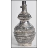 A 19th century Chinese silver drinking flask of bulbous form, the globular body of Gu shape having