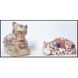 Two large 20th century Oriental Chinese pottery Imari pattern cats. One being a lidded food pot