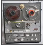 A vintage 20th century Akai x - 355 Solid State Cross Field Stereo reel to reel player together with