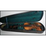 A 20th century Antonius Stradivarius violin and bow within fitted case. Paper label to interior.