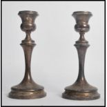 A pair of silver hallmarked candlesticks by Marson & Jones of Birmingham 1923. Each raised on