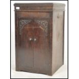 An Edwardian mahogany box pedestal gramaphone cabinet of upright form with hinged top opening to