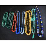 A group of vintage early 20th century necklaces to include jade semi precious stones millefiori cane