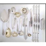 A collection of Danish Silver Plated serving spoons and ladels each with  with intricate rococo