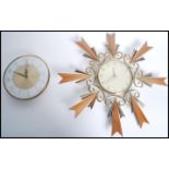 Two vintage mid 20th century retro wall clocks one being a Metamec clock having a white and gilt