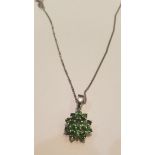 A 9ct white gold ladies necklace and emerald garnet cluster pendant. Total weight 3.4g