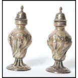 A pair of Edwardian Goldsmiths and Silversmiths Company of London silver hallmarked table