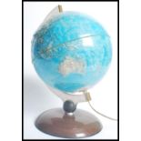 A 20th century table top globe by Nova Editions Rico Florence. Raised on faux rosewood with clear