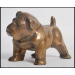 An early 20th century bronze figurine of a bulldog with detailed features. Measures 8cms high.