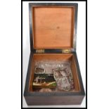A 19th century ebony work box containing an enamel and gilt firefly brooch an oversized rhinestone